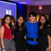 President Mantella poses with a group of grad students